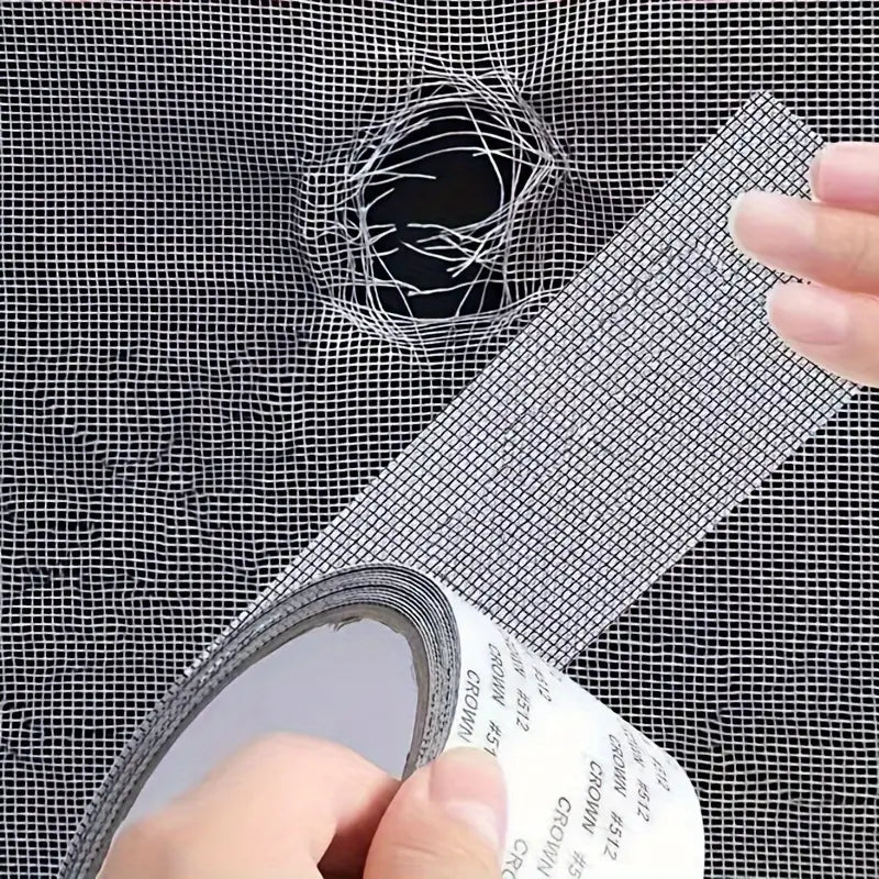 Applying anti insect mesh patch tape over a torn hole in a window screen