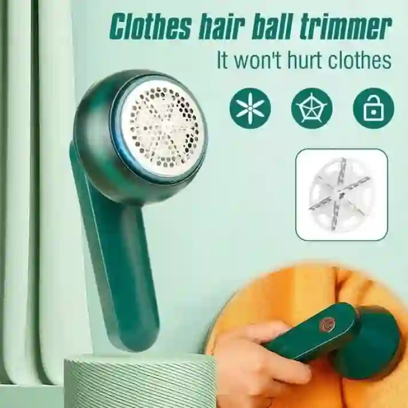 Green rechargeable lint remover used as a clothes hair ball trimmer on a sweater