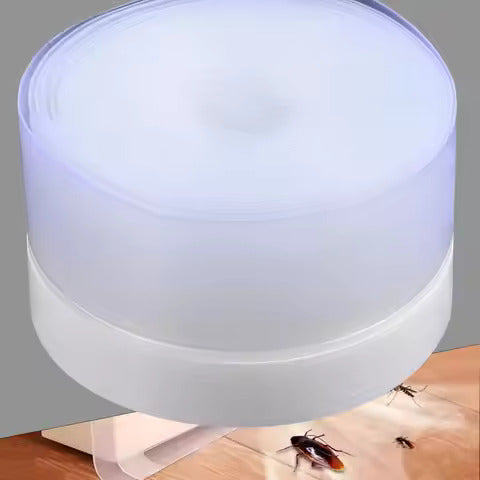 Silicone door draft stopper roll sealing the gap under a door to block insects