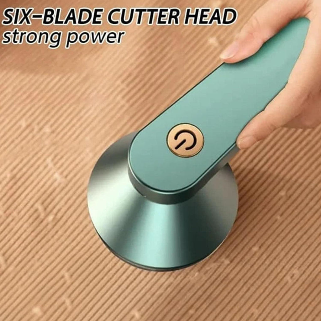 Rechargeable lint remover with six-blade cutter head being used on fabric